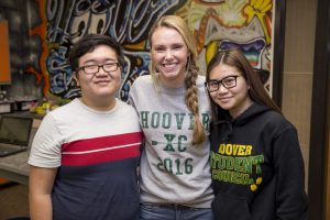 Three high school students standing